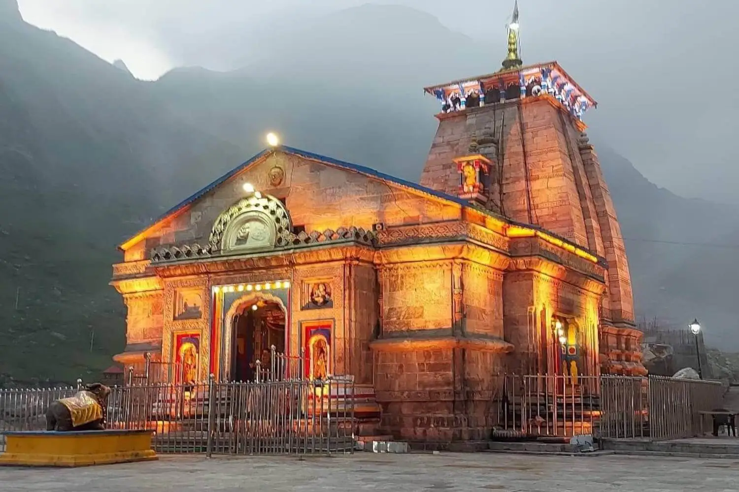 orkers involved in the restoration and preservation efforts of Kedarnath Temple following a devastating flood, showcasing ongoing reconstruction work.