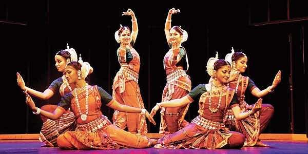 Odissi dancer showcasing expressive hand gestures (mudras) 